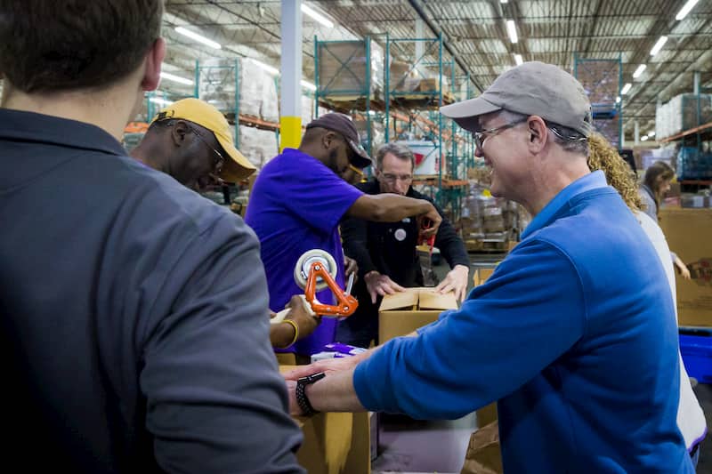 Volunteers distributing food boxes